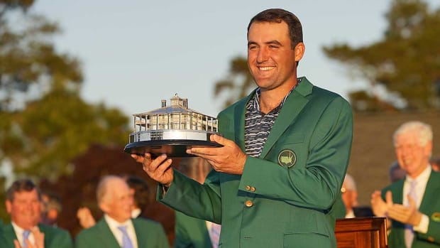 Scottie Scheffler holds the Masters trophy after winning on Sunday, April 10, 2022.